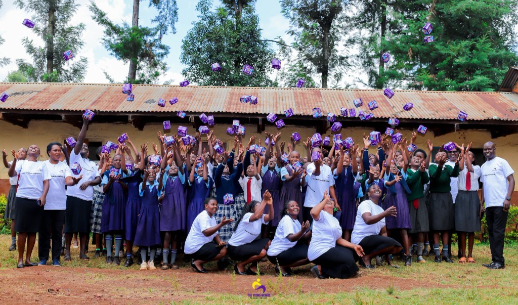 School outreach celebration with menstrual dignity packs